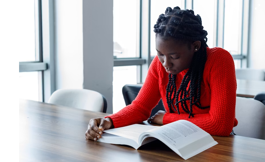 Students studying together in a bright library